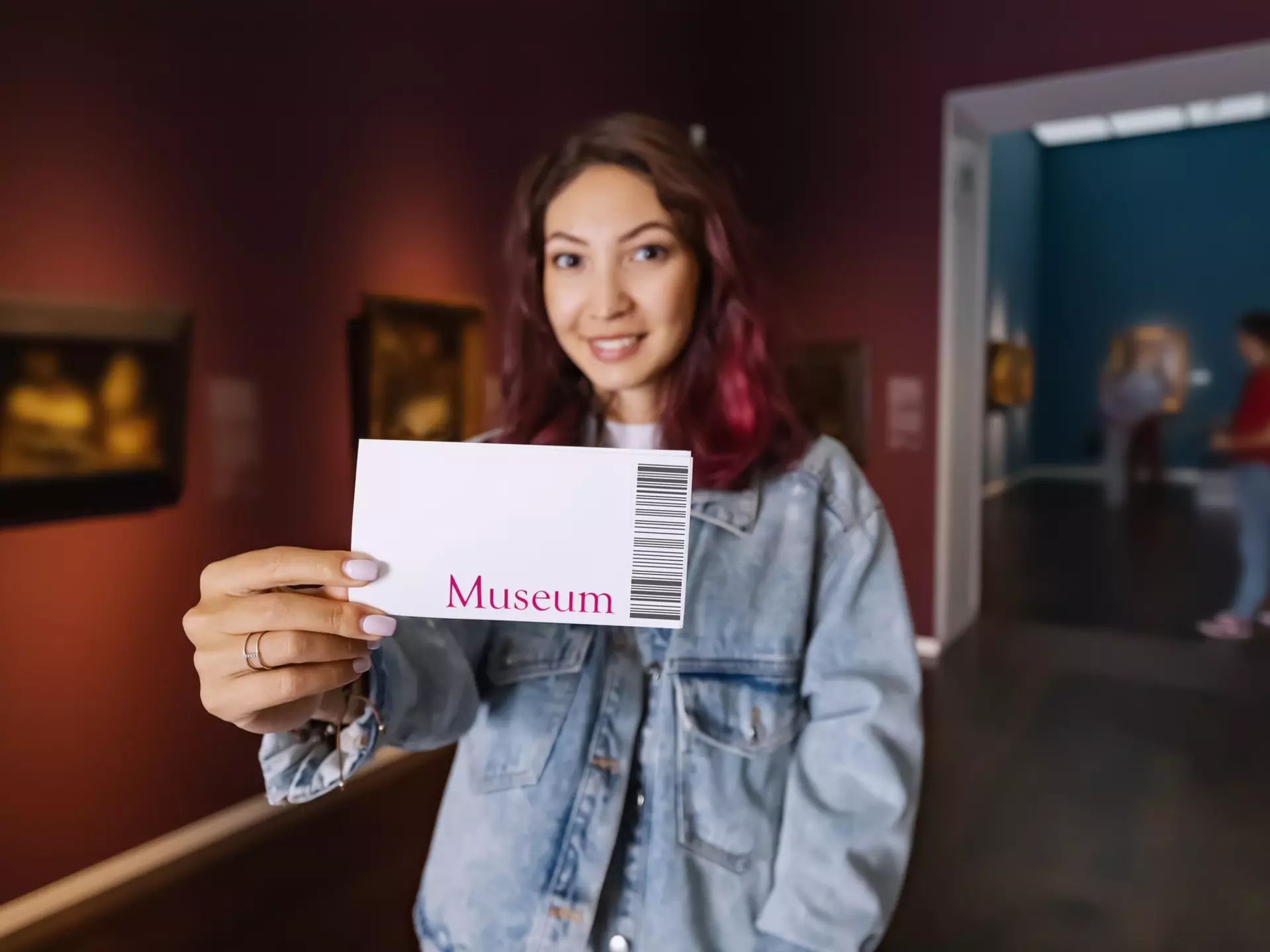 Visitor holding ticket to fine art museum with paintings. Art exhibition and entertainment, License Type: media, Download Time: 2025-12-09T22:12:31.000Z, User: Norma.PrauseBrewer_LonelyPlanet, Editorial: false, purchase_order: 56530 - Guidebooks, job: Global Publishing WIP, client: Europe 5, other: Norma Brewer