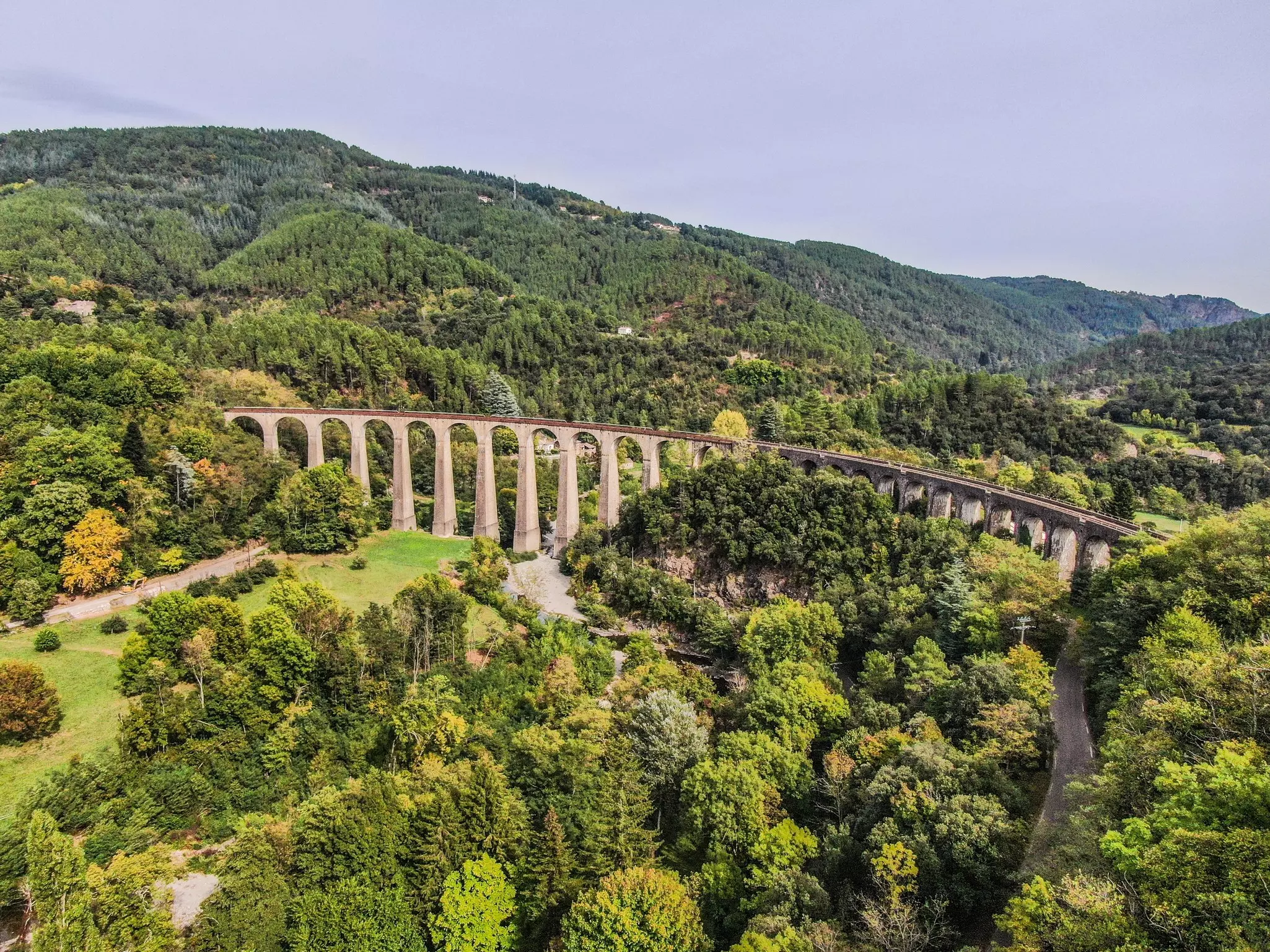 A view of the Chamborigaud viaduct crossing a forested valley near Cevennes, France. 