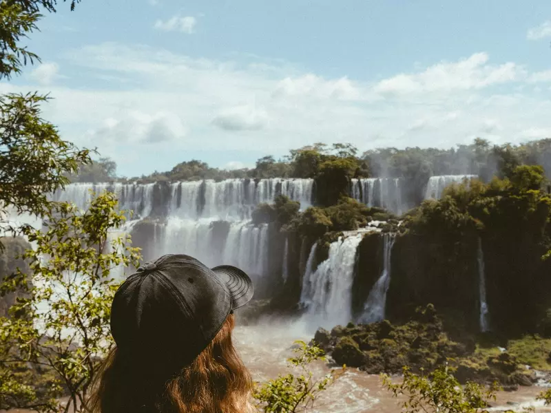 Waterfalls cover a large area, with multiple cascades at several levels.