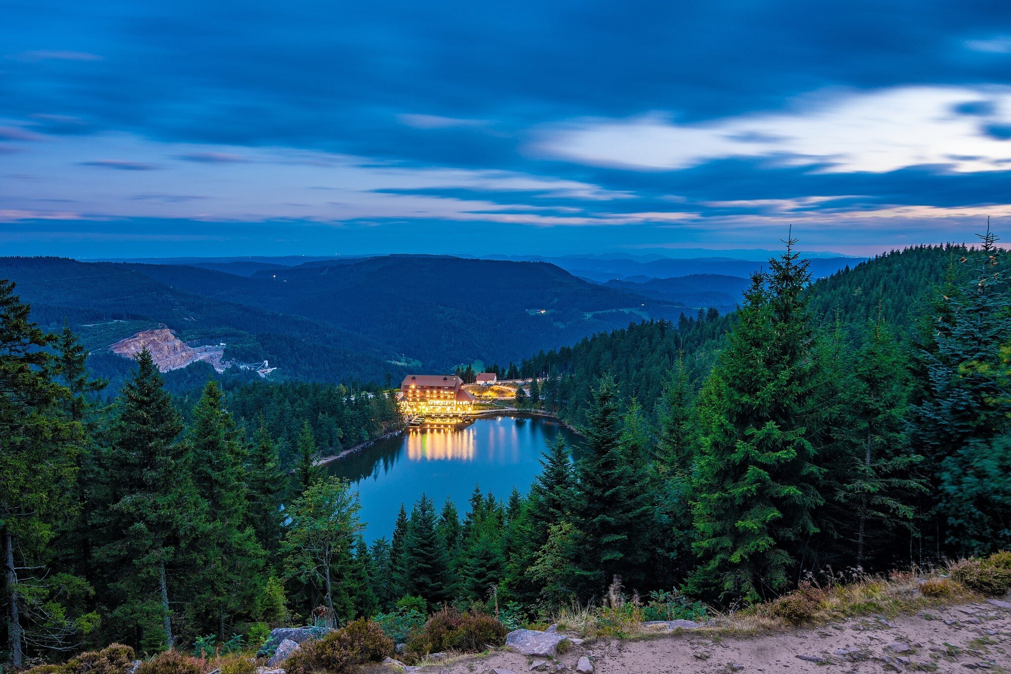 High-angle view of the Mummelsee lake at night in the Black Forest, Germany.