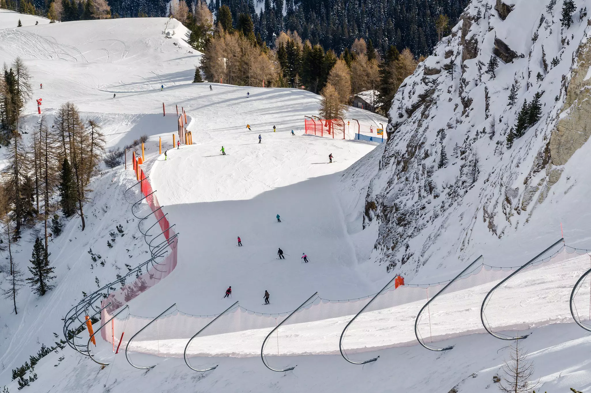 People skiing on the Dolomite Alps near Alta Badia