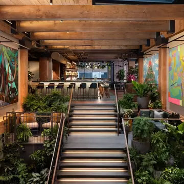 Stairs in a hotel going to the dining room.