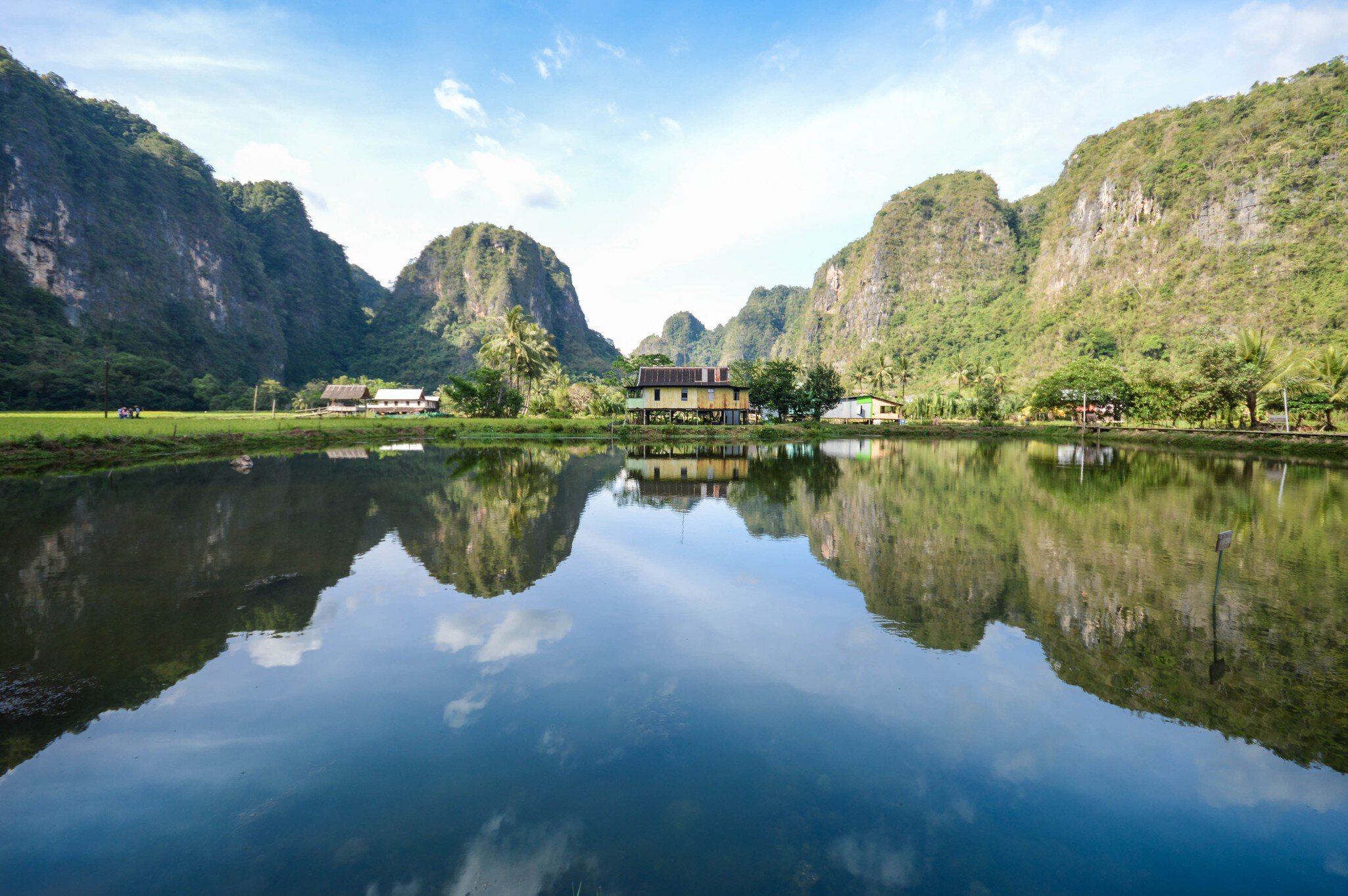 Beautiful limestones and water reflections in Rammang Rammang park near Makassar, South Sulawesi, Indonesia