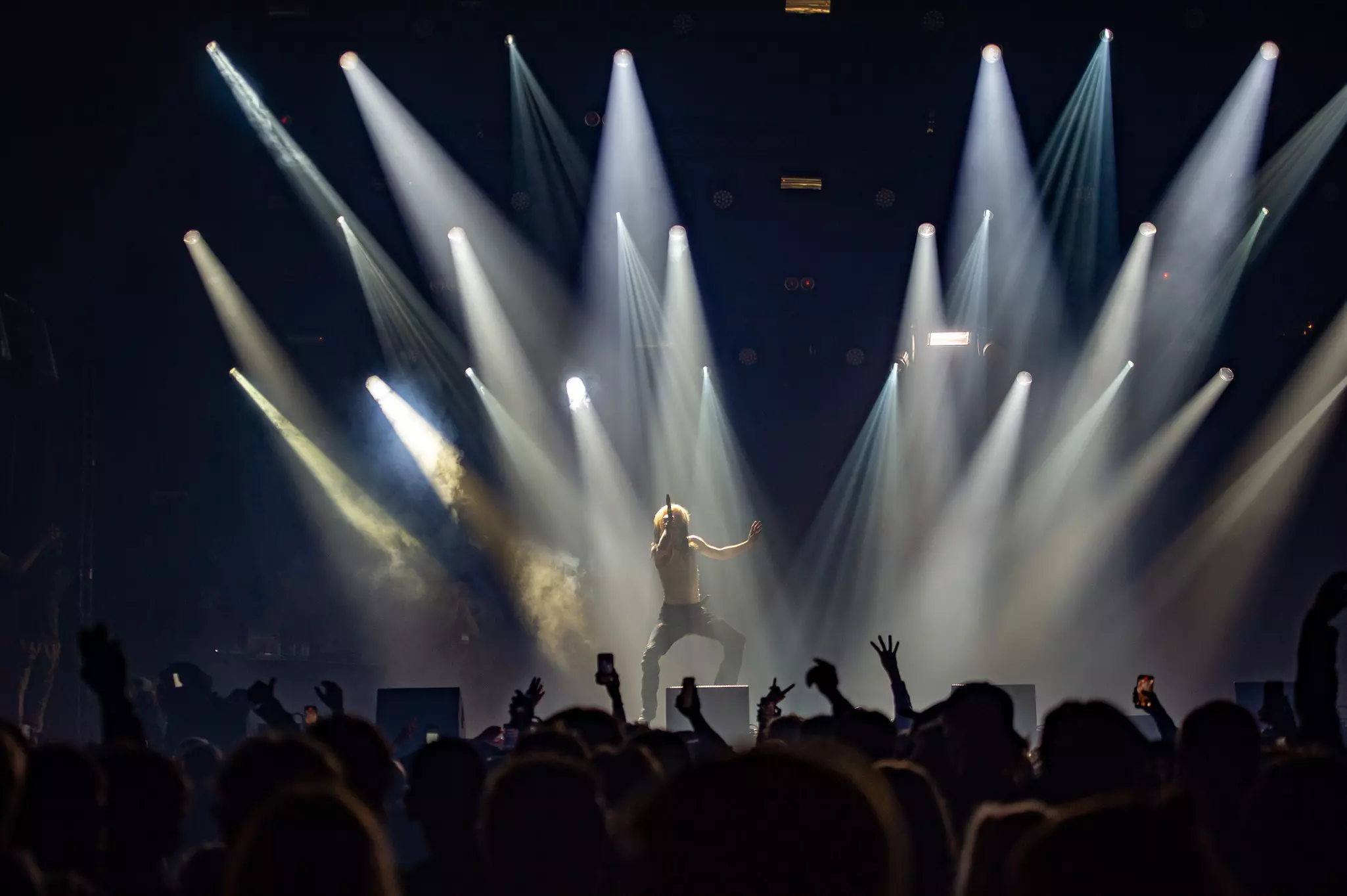 A large crowd of people lounge around in the sunshine at the Ruisrock festival on Ruissalo Island.