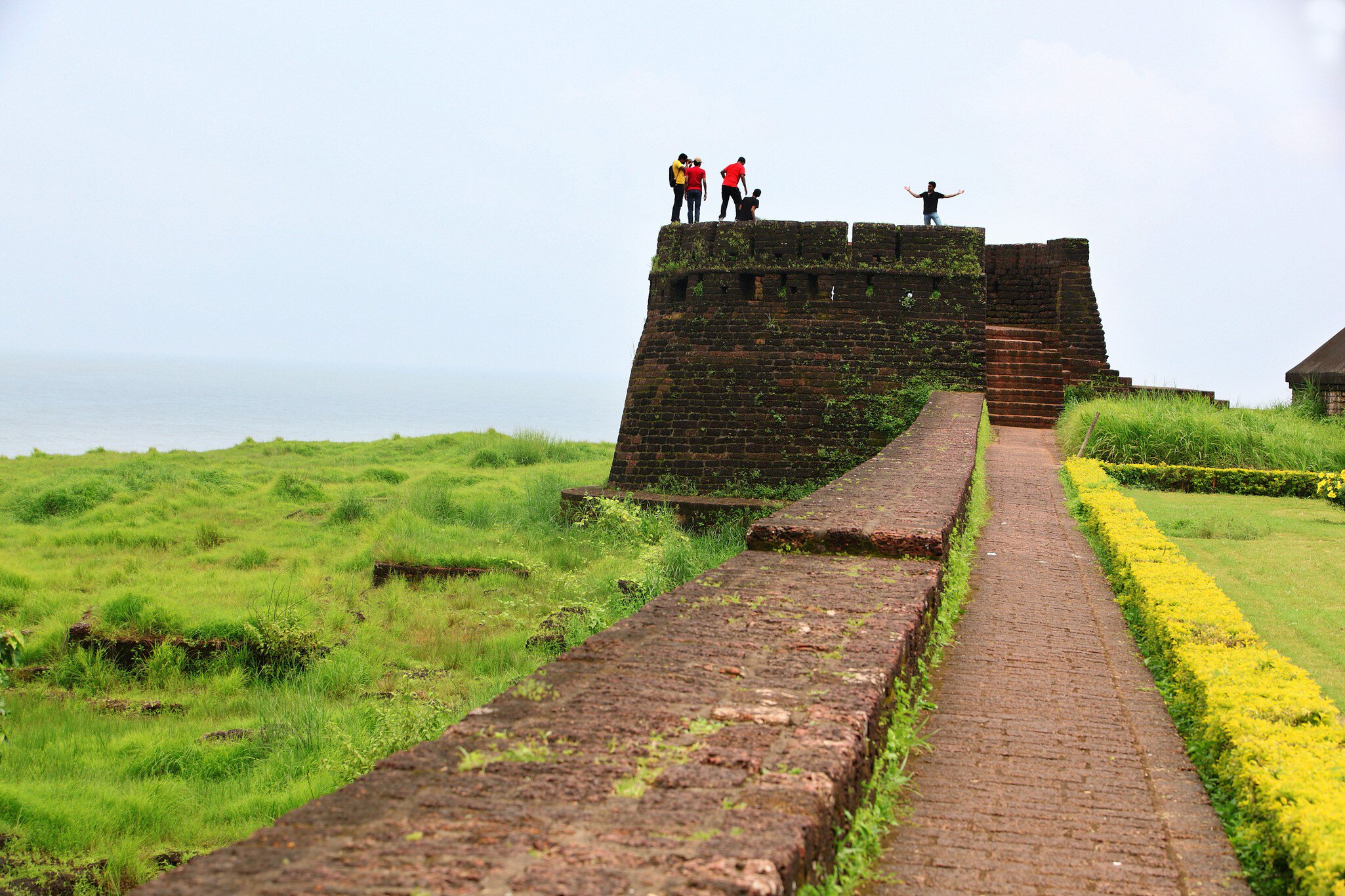 People standing atop Bekal Fort, the largest fort in Kerala, situated at Kasaragod district, North Kerala. spreading over 40 acres.