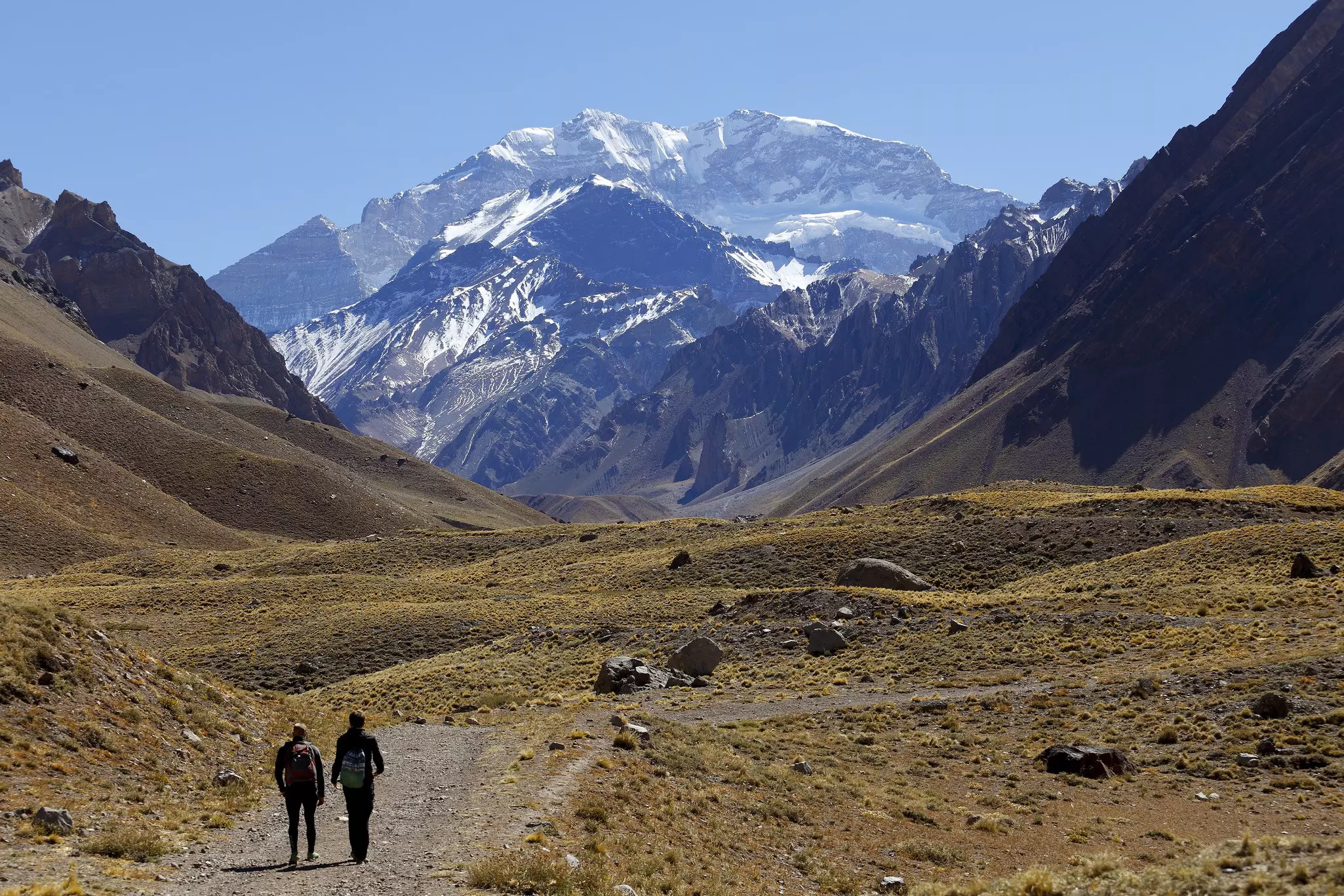 Hikers walking towards Aconcagua, the highest mountain in the Americas, Mendoza, Argentina