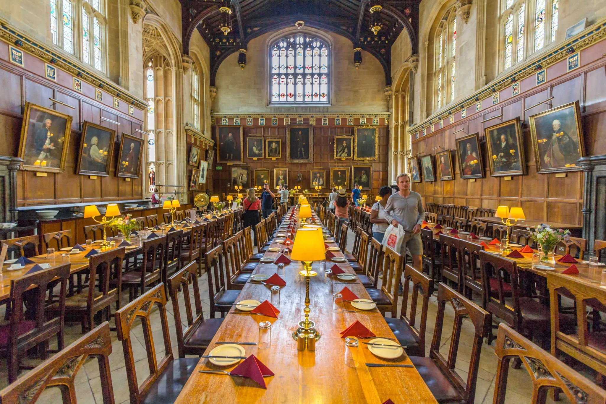 The great hall of Christ Church, University of Oxford, England, laid out with plates and cutlery for the students and academics.