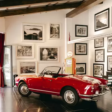 Vintage red car in the Open air gallery, Sorrento, Italy.