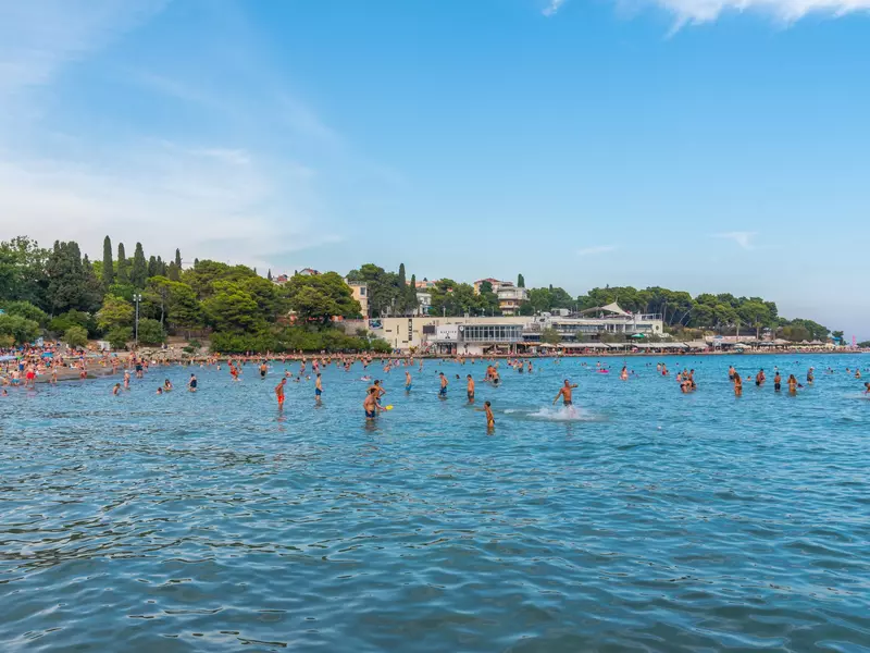 People are enjoying a sunny day at the beach