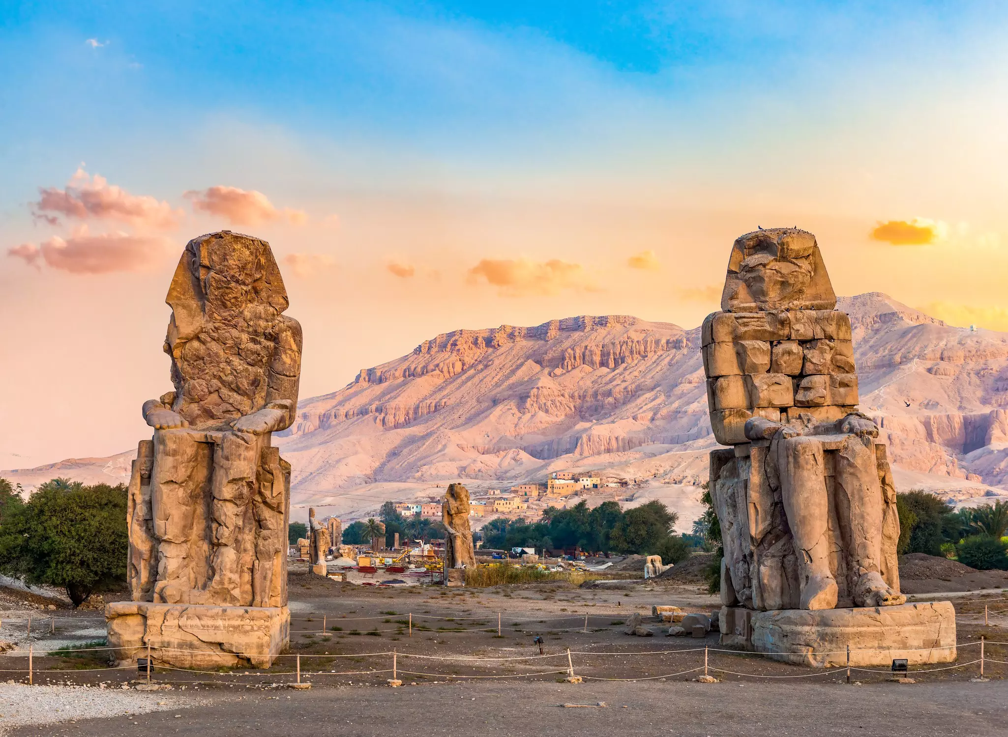 Sunrise over Colossi of Memnon in Luxor, Egypt