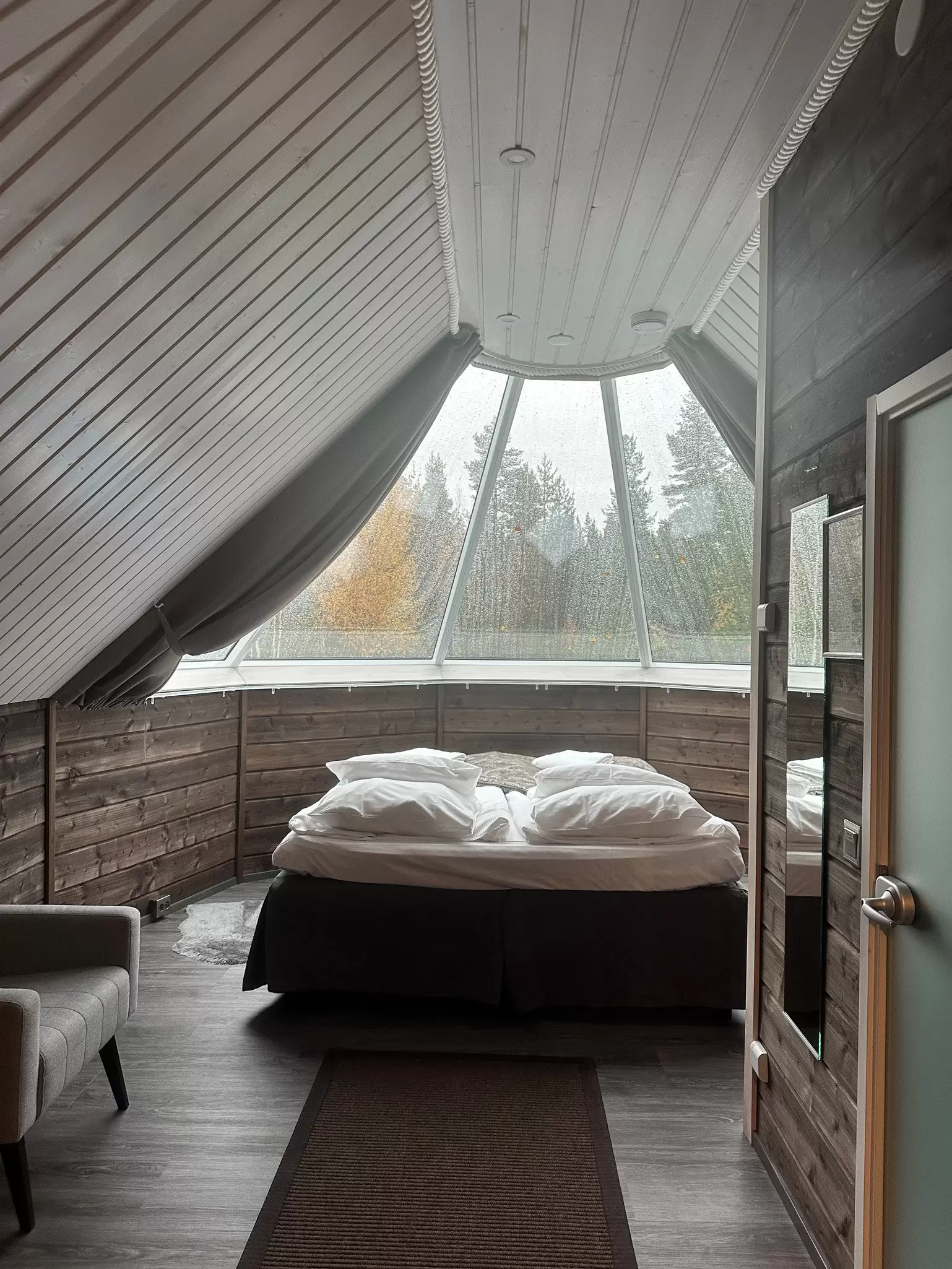An interior view of a glass-roofed cabin at Aurora Village in Ivalo in Finnish Lapland. 