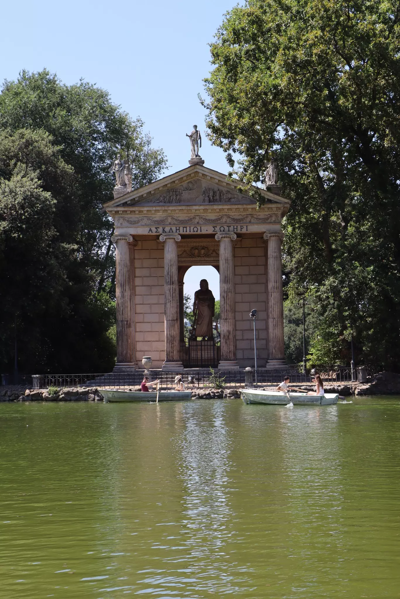 Ancient columns with blue waters in the background