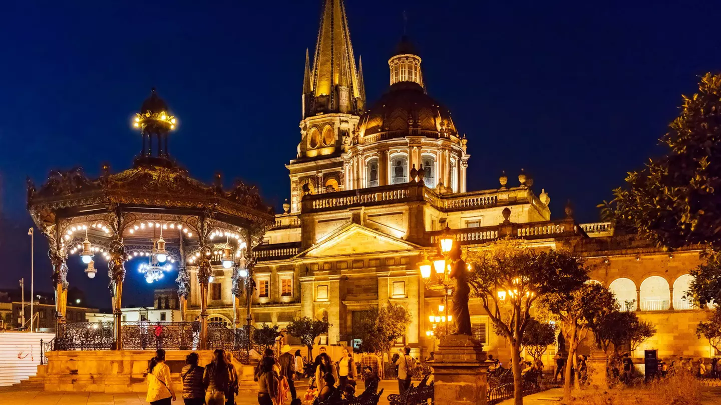 A cathedral in Guadalajara's historic center lit up at night