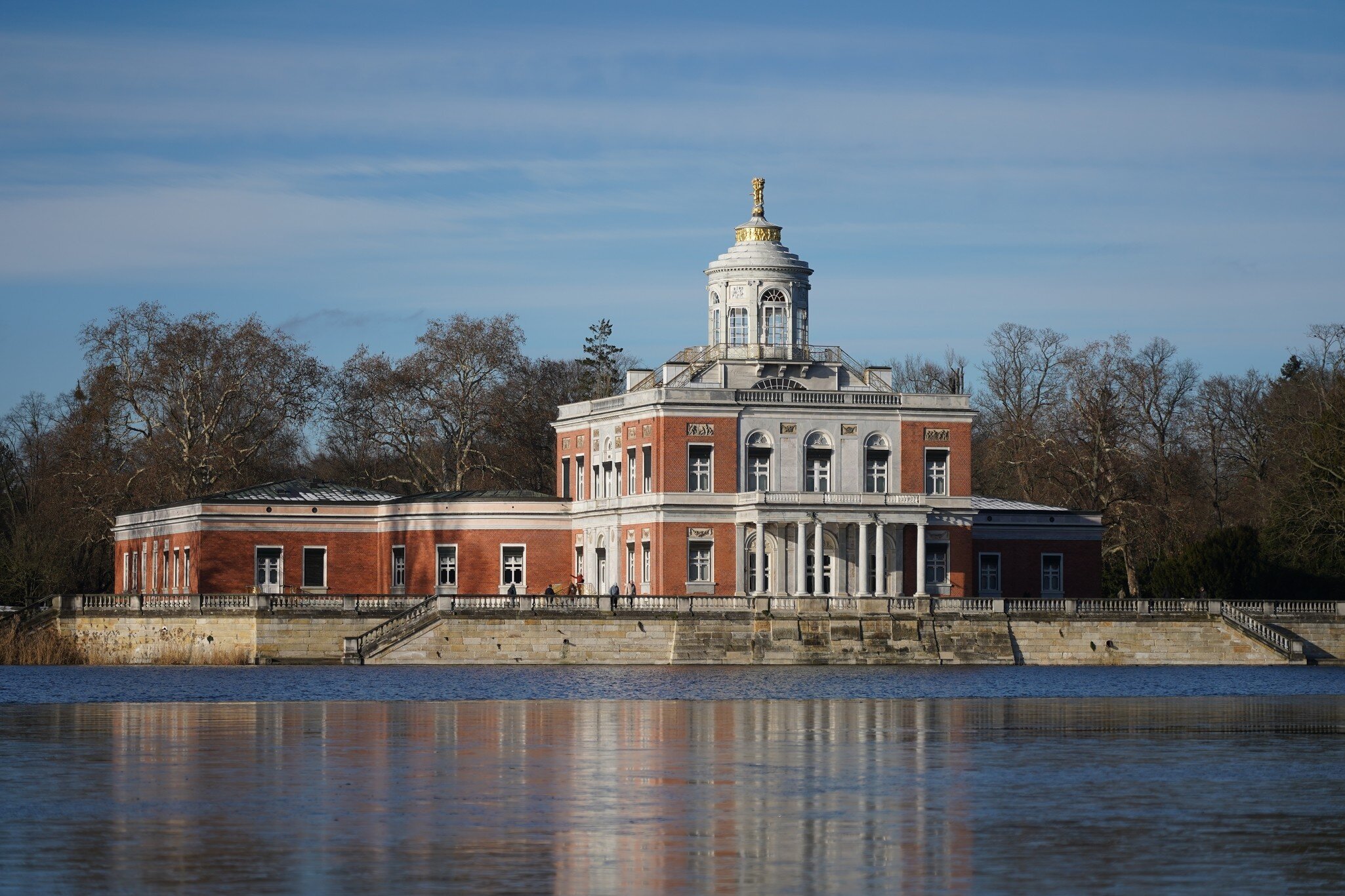 Exterior view of Marmorpalais with reflection at Heiliger See in Potsdam, Germany, during the winter season.