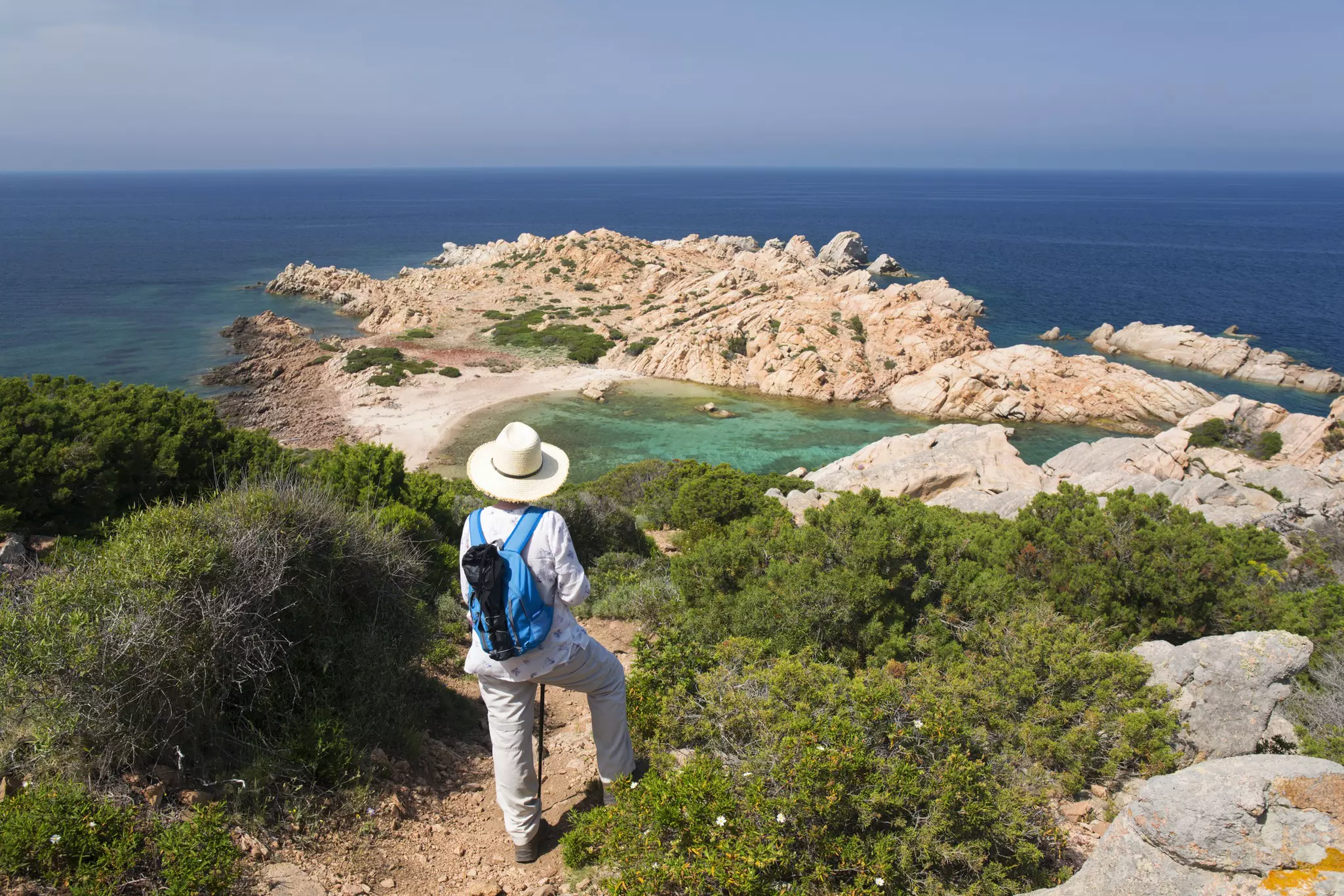 Hiker taking in the view at Parco Nazionale dell'Arcipelago di La Maddalena.