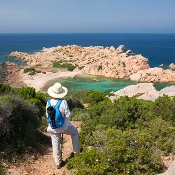 Hiker taking in the view at Parco Nazionale dell'Arcipelago di La Maddalena.