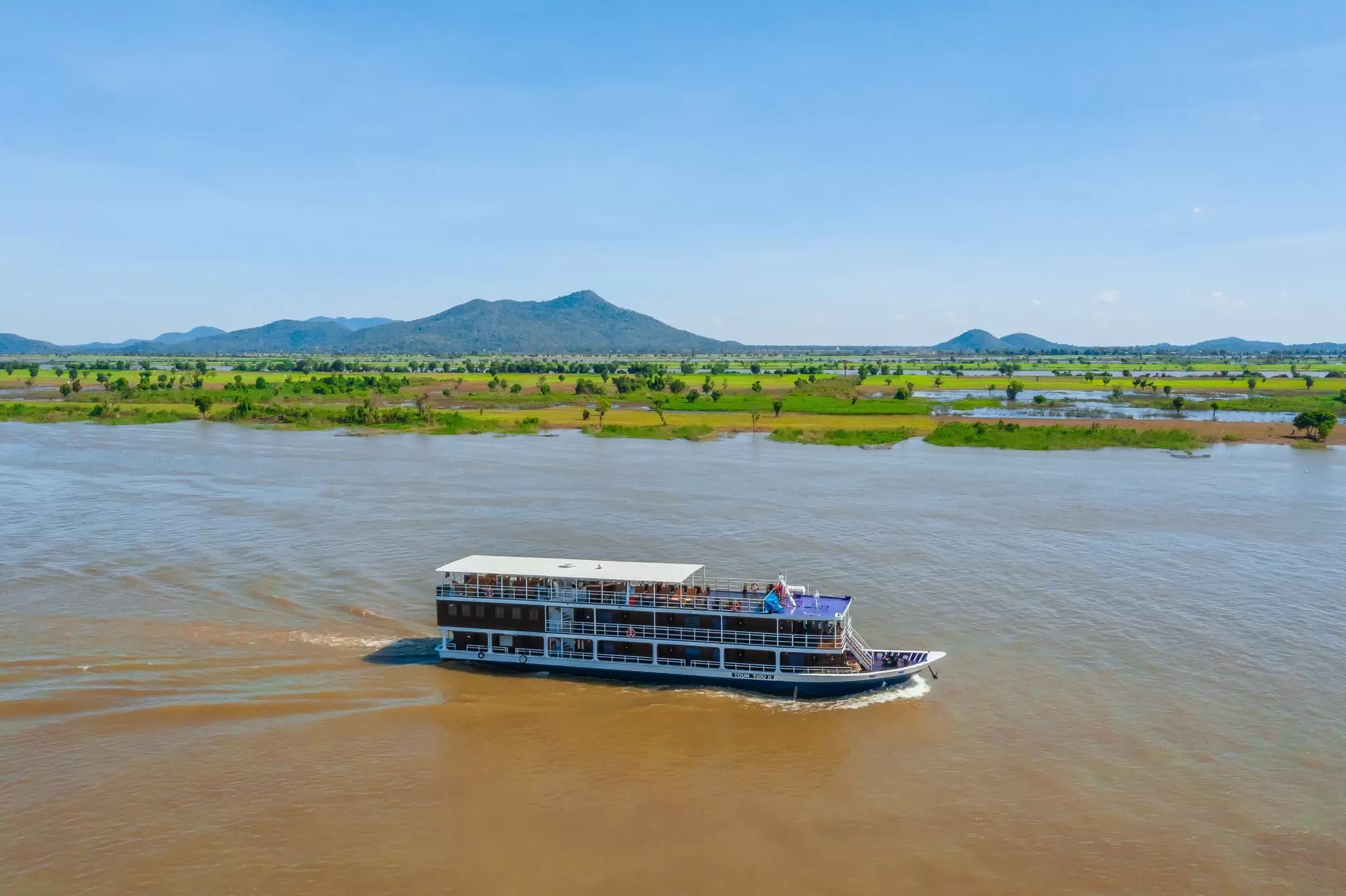 Toum Tiou II sailing along the Mekong. CF Mekong