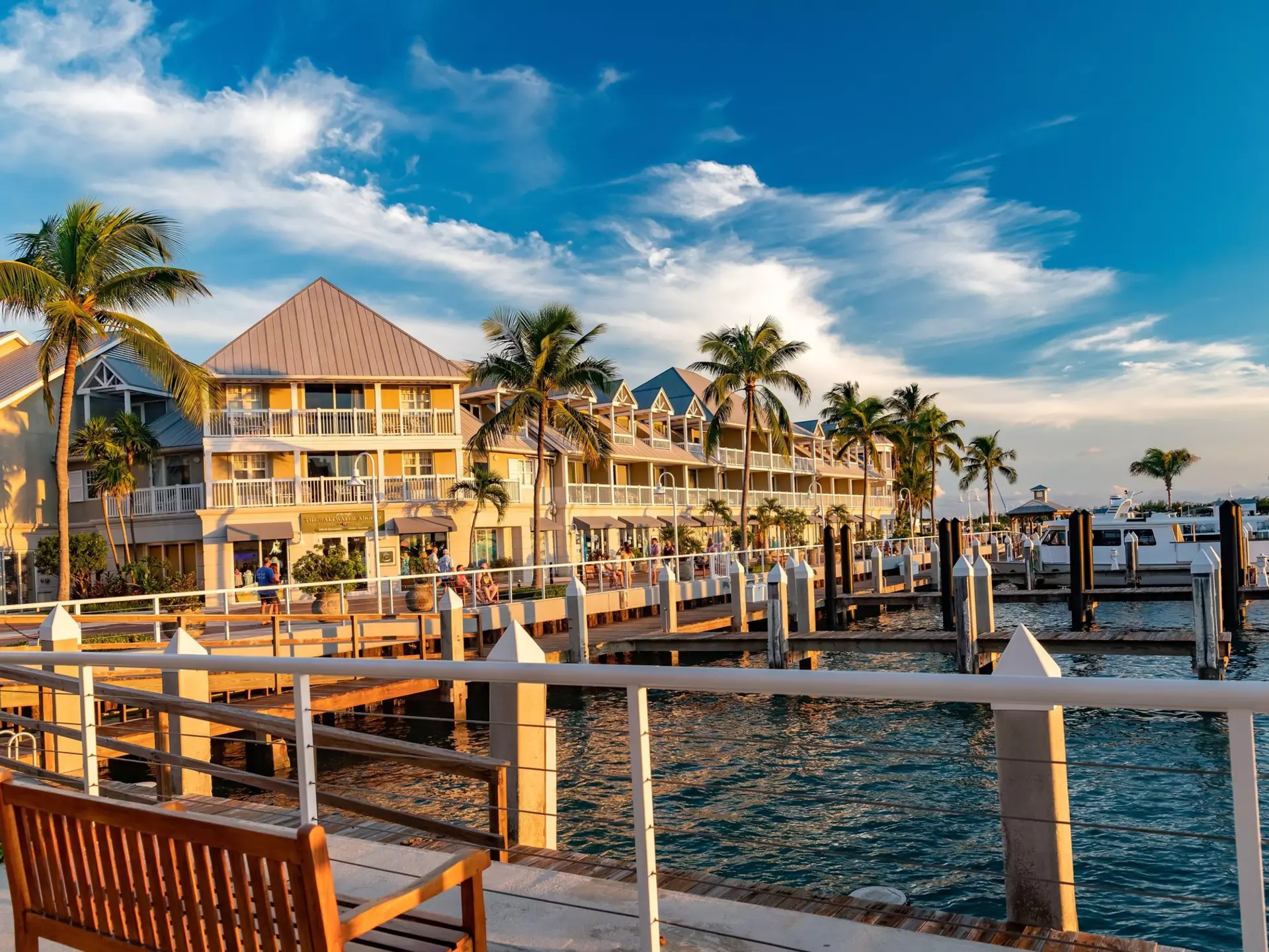 Sunset glow on an oceanfront hotel and docked boats in Key West