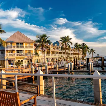 Sunset glow on an oceanfront hotel and docked boats in Key West