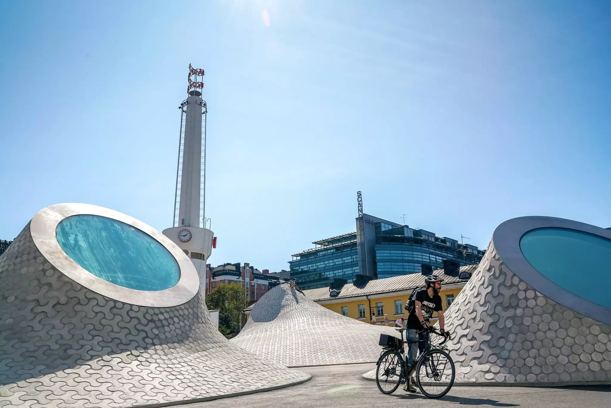 A cyclist rides around the rooftop skylights of the Amos Rex art museum in Helsinki.