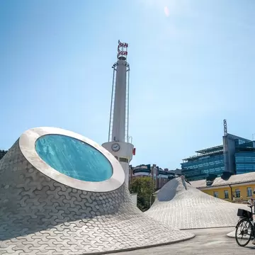 A cyclist rides around the rooftop skylights of the Amos Rex art museum in Helsinki.