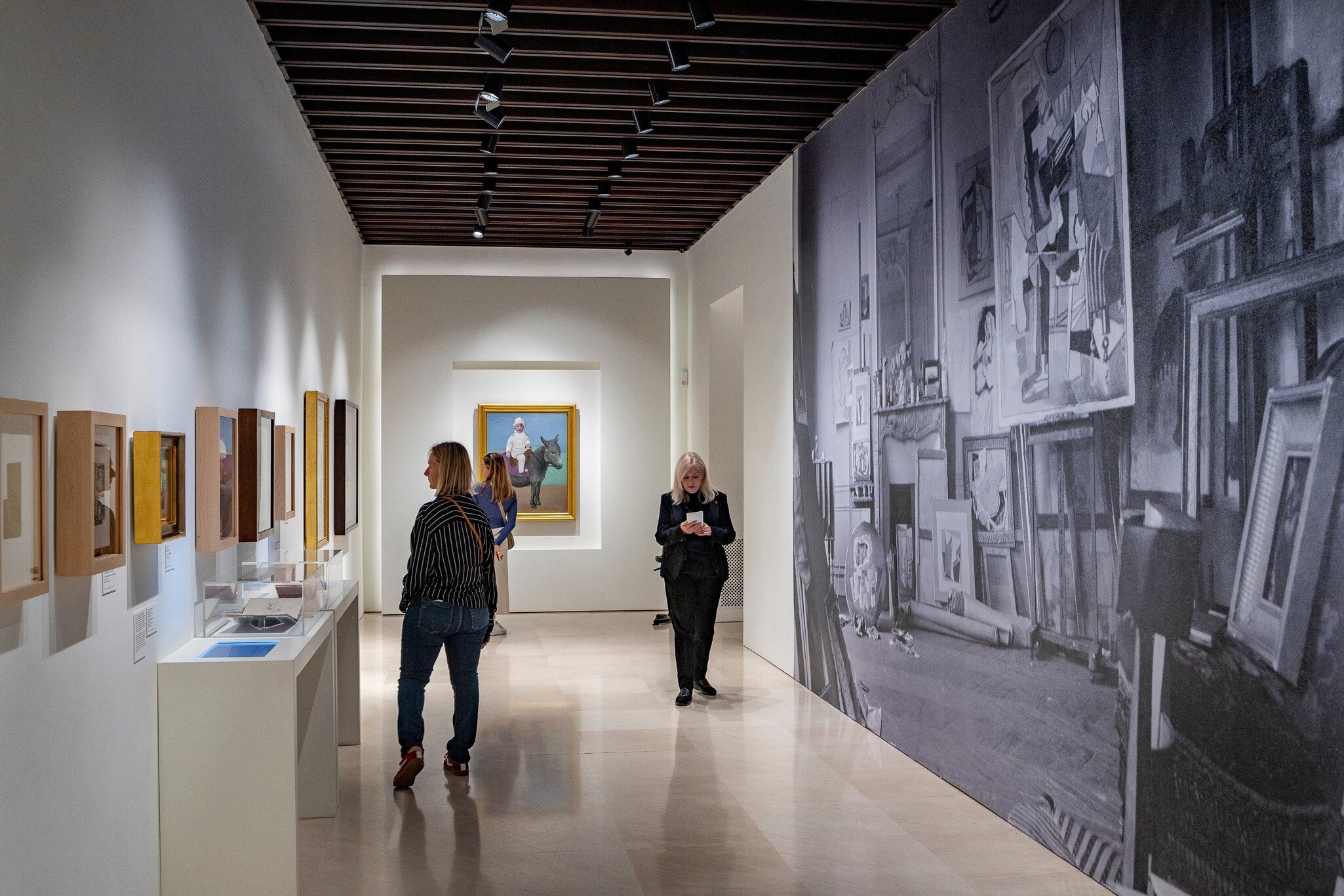 Visitors look at artworks in the Museo Picasso Málaga in Spain.
