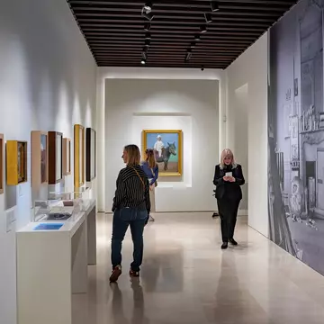 Visitors look at artworks in the Museo Picasso Málaga in Spain.