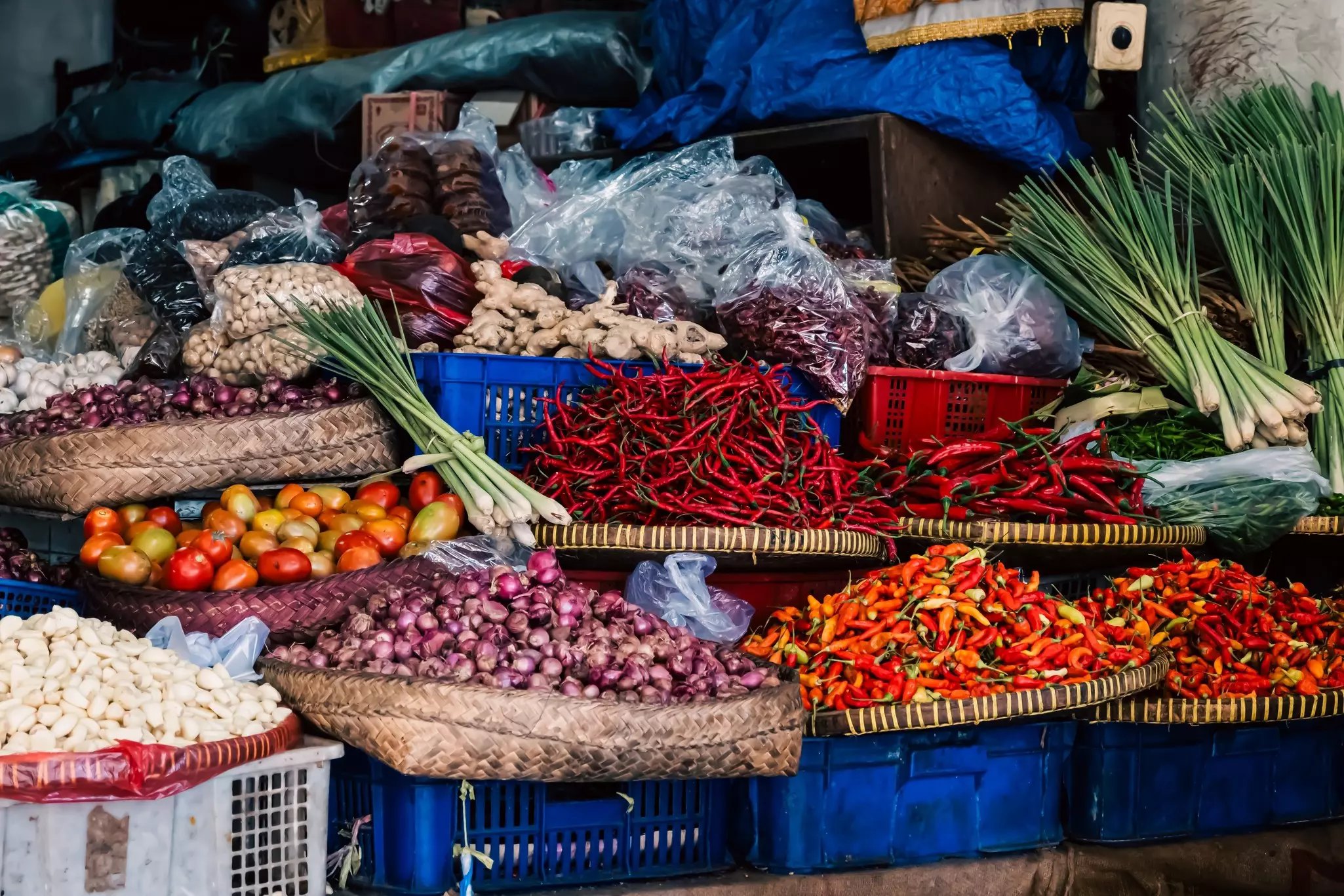 Colorful collection of vegetables, spices, nuts and lemon grass for sale in Pasar Badung, the main Denpasar city market in Bali