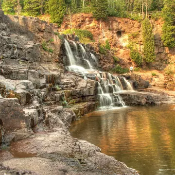 An autumn waterfall scene at Gooseberry Falls State Park in Minnesota