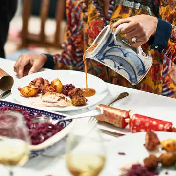 Tuck into turkey and countless side dishes during Christmas dinner in the UK. Getty Images