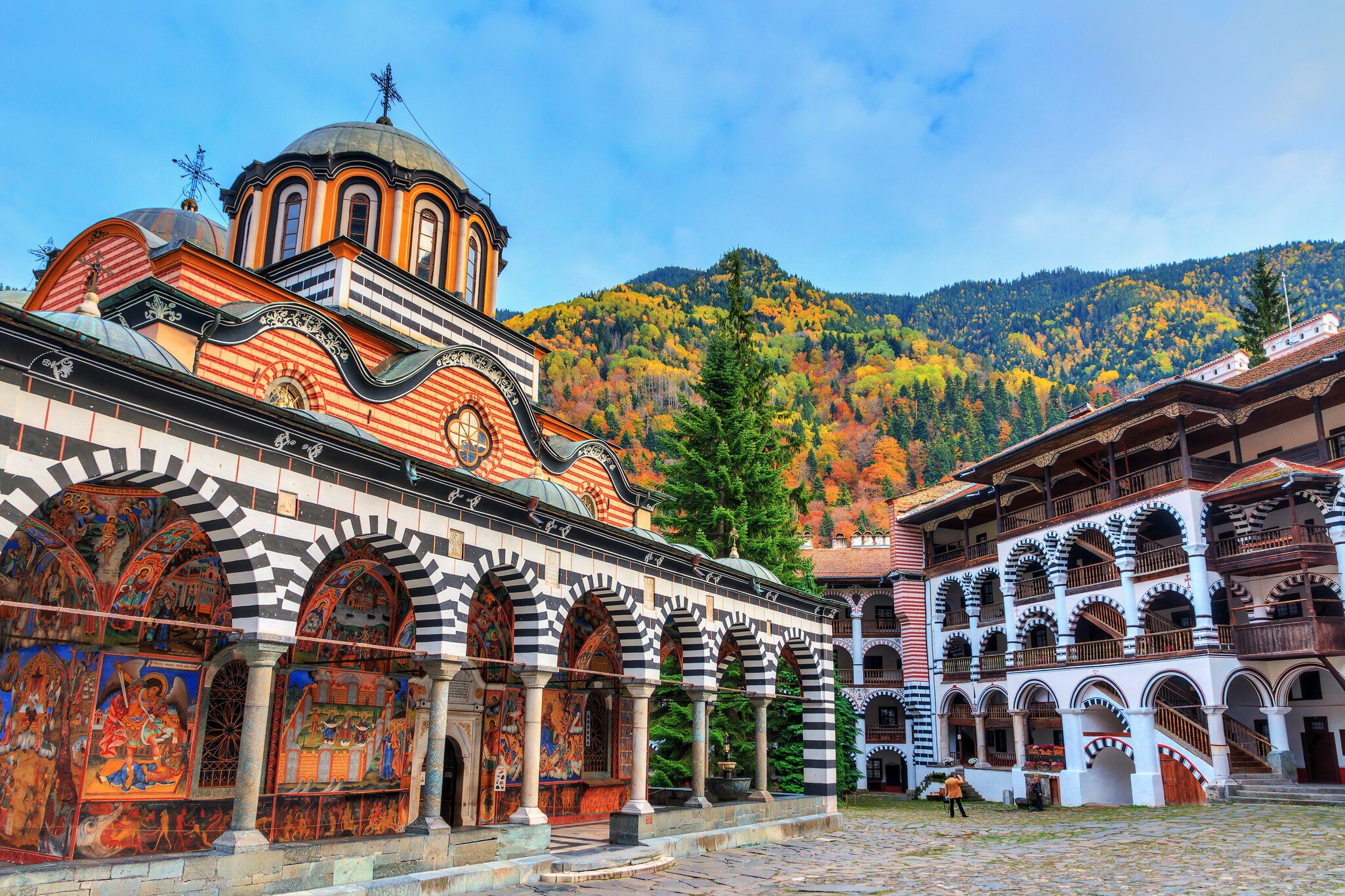 Exterior of the Orthodox Rila Monastery in the Rila Nature Park.
1160109394
ancient, architecture, attraction, autumn, beautiful, blue, building, bulgaria, church, city, clouds, courtyard, culture, destination, europe, exterior, facade, fall, famous, heritage, historic, history, journey, landmark, medieval, monastery, monument, mountains, national, national park, october, old, orthodox, park, religion, religious, rila, rila monastery, rila nature park, sky, structure, tourism, tourist, town, travel, unesco, vacation, vibrant, visit