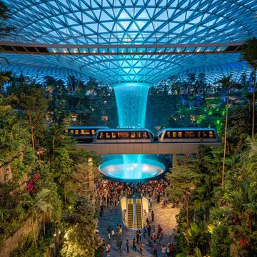 Check out these innovative sustainable attractions worldwide, like the Jewel at Changi Airport. Travel man / Shutterstock