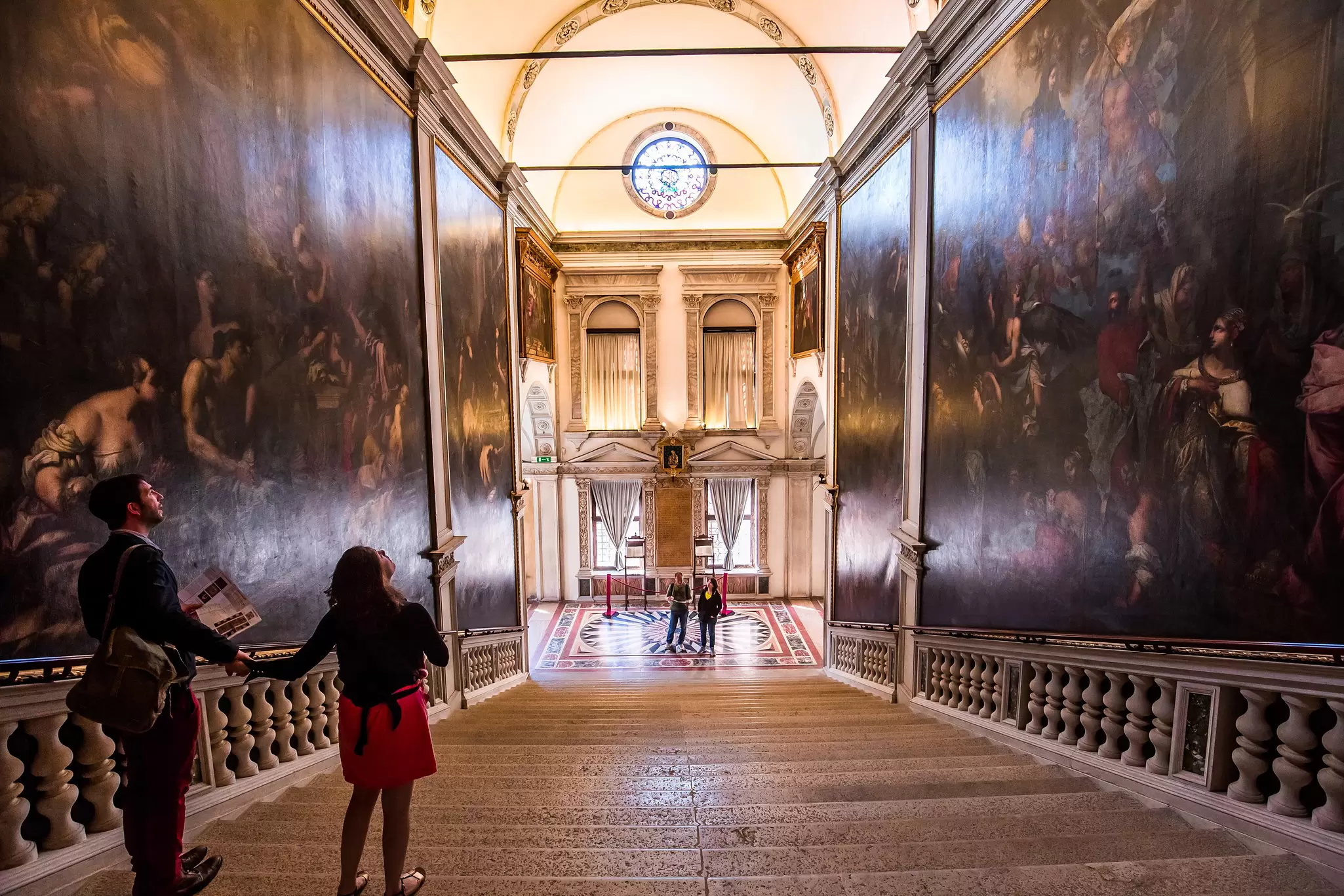 View of Antonio Zanchi’s 'Virgin Appearing to the Plague Victims' on the Scarpagnino Staircase in the Scuola Grande di San Rocco in Venice, Italy.