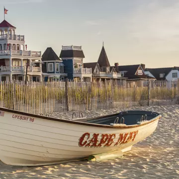 Victorian Homes and hotels line Beach Ave. in Cape May with lifesaving rescue boat on the beach.
589147486
watercraft:CB2, sand:CB2, old-fashioned:CB2, travel:CB2, protection:CB2, house:CB2, architecture:CB2, daytime:CB2, Victorian:CB2, Americana:CB2, outdoors:CB2, building:CB2, beach:CB2, nobody:CB2, fence:CB2, mooring:CB2, safety:CB2, Cape May:CB2, building exterior:CB2