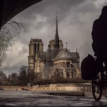 Cycling along the Seine near Notre Dame, Paris. Benjamin Volot/Getty Images