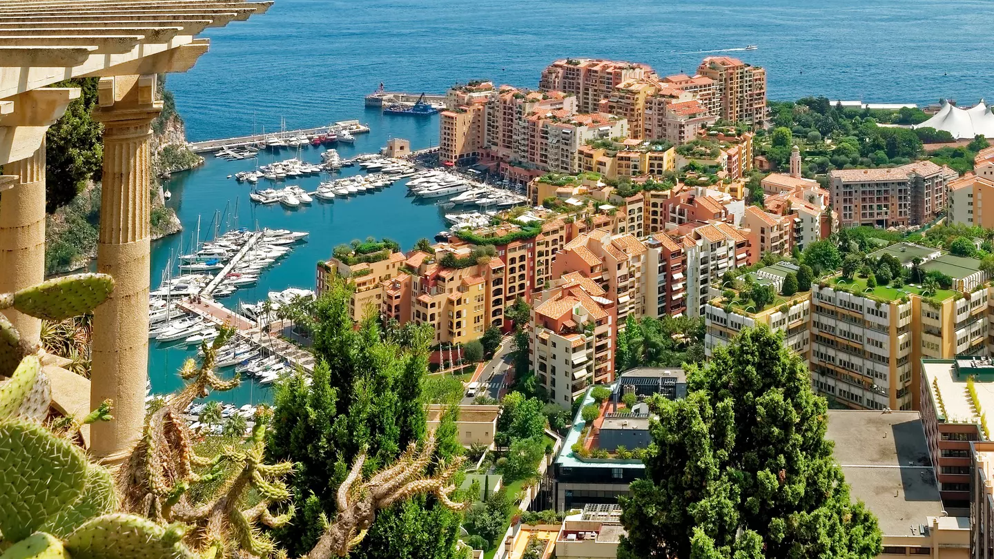 Aerial view of Monaco with apartments and boats in a marina