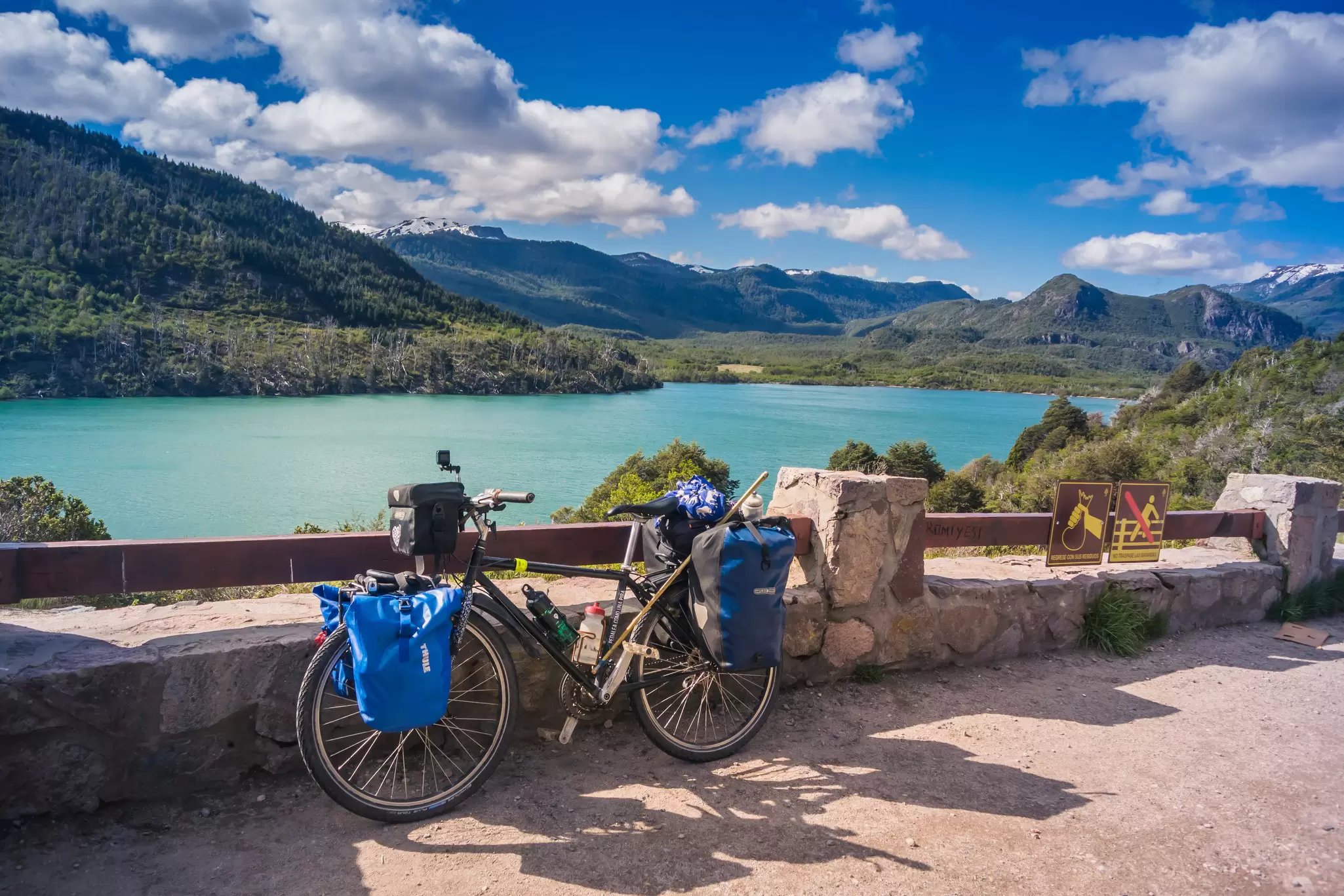 View of a bike by Machonico Lake on a sunny day in Argentina.