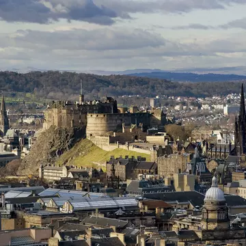 A view over the rooftops of Edinburgh to Edinburgh Castle, Scotland.