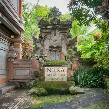 Indonesia, Bali - September 16, 2017: Entrance area to the Neka art museum that is built in traditional balinese architectural style. Neka art museum is a cultural attraction of Bali, Indonesia.  License Type: media  Download Time: 2024-03-14T08:43:58.000Z  User: mvm_lonelyplanet  Is Editorial: Yes  purchase_order:   