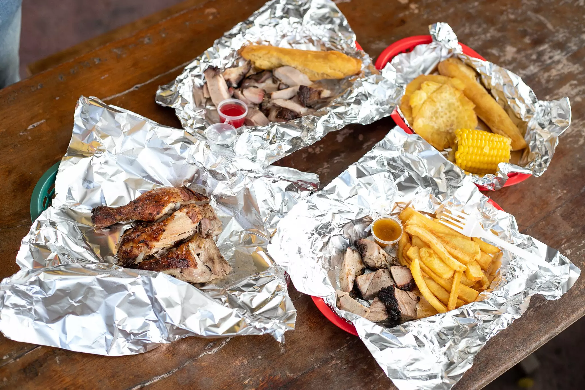 Jerk chicken and sides seen on a table at PeppaThyme, Jamaica
