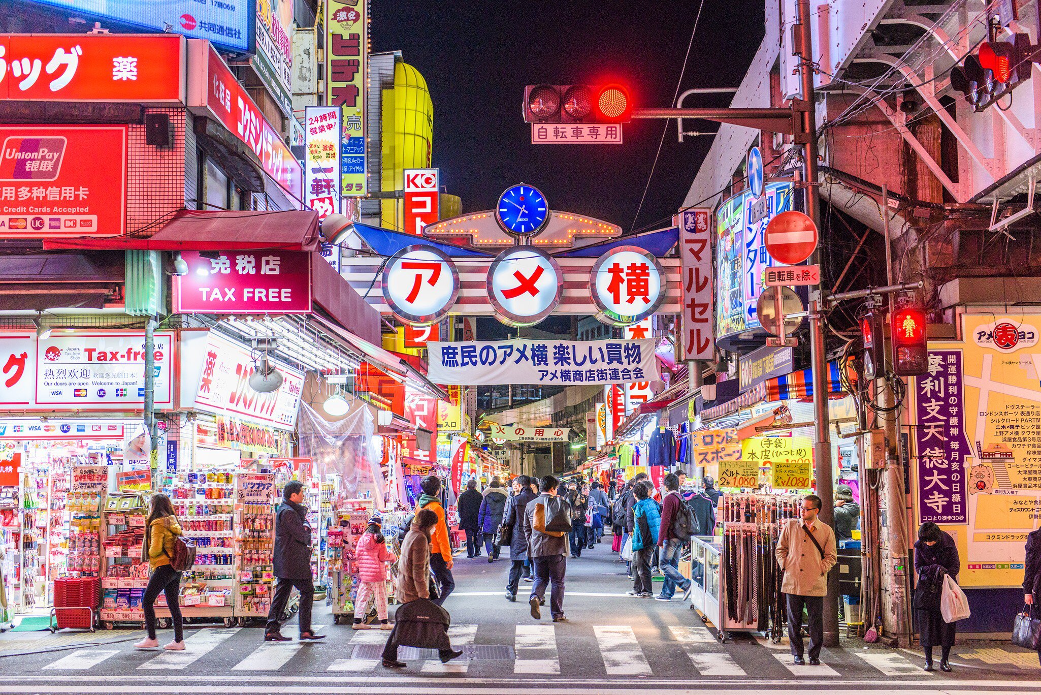 TOKYO - DECEMBER 31:  A fishmonger sells seafood at a fish stall in the Ameya Yokocho street market on December 31, 2008 in Tokyo, Japan. People shop around in preparation to celebrate the New Year holidays at the market featuring over 500 stalls,...