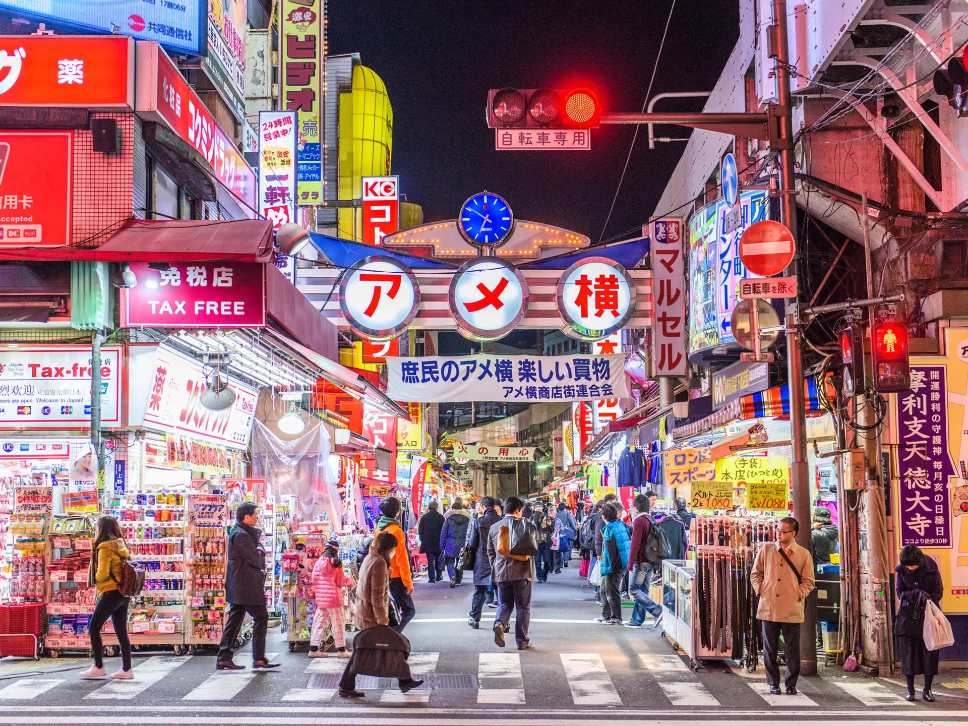 TOKYO - DECEMBER 31:  A fishmonger sells seafood at a fish stall in the Ameya Yokocho street market on December 31, 2008 in Tokyo, Japan. People shop around in preparation to celebrate the New Year holidays at the market featuring over 500 stalls,...