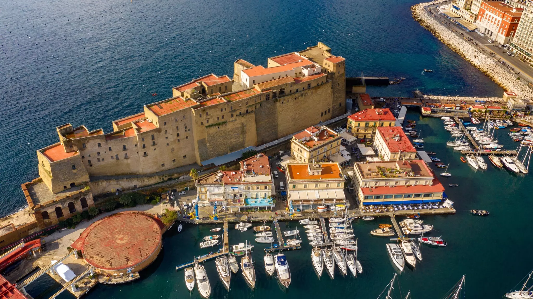 Aerial view of Castel dell'Ovo on the sea in the Gulf of Naples, Italy
