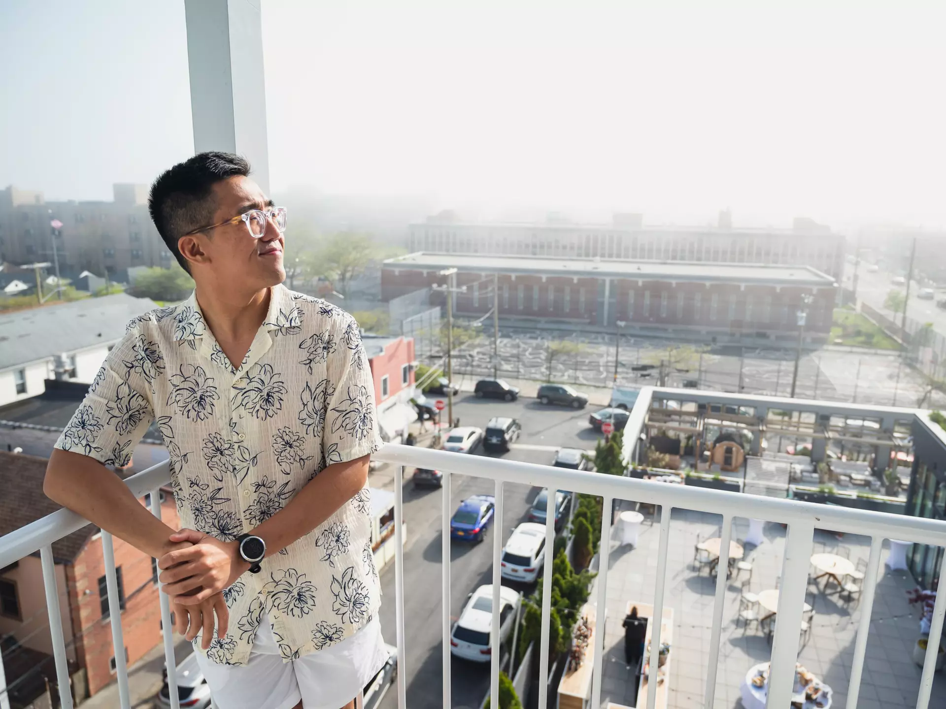 Chris Dong on his hotel room's balcony, Rockaway Hotel