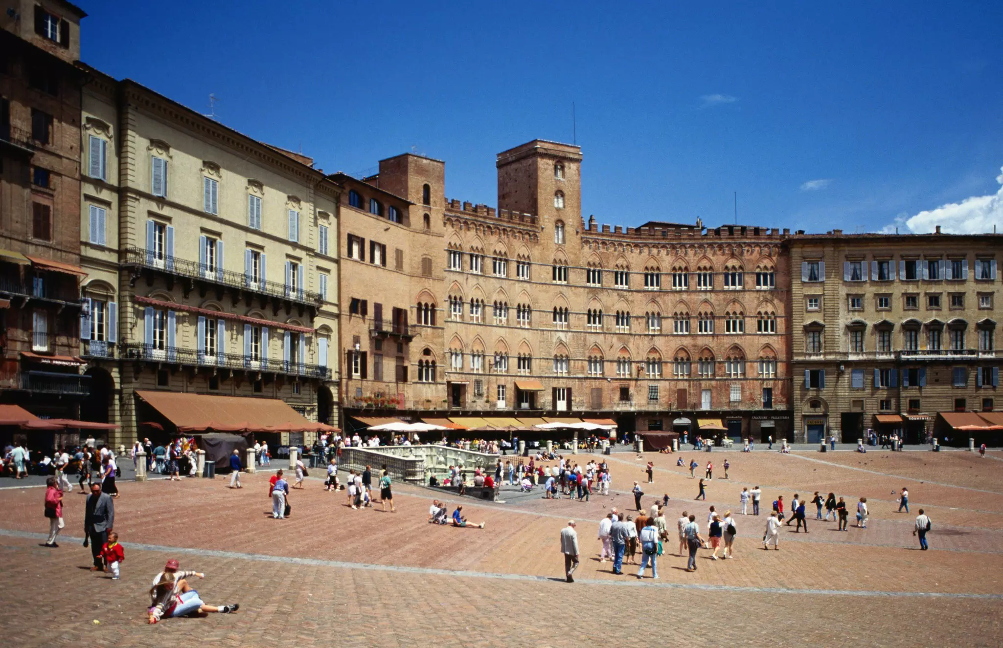 Grand buildings ring the Piazza Il Campo in Siena, Tuscany, Italy.