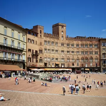 Grand buildings ring the Piazza Il Campo in Siena, Tuscany, Italy.