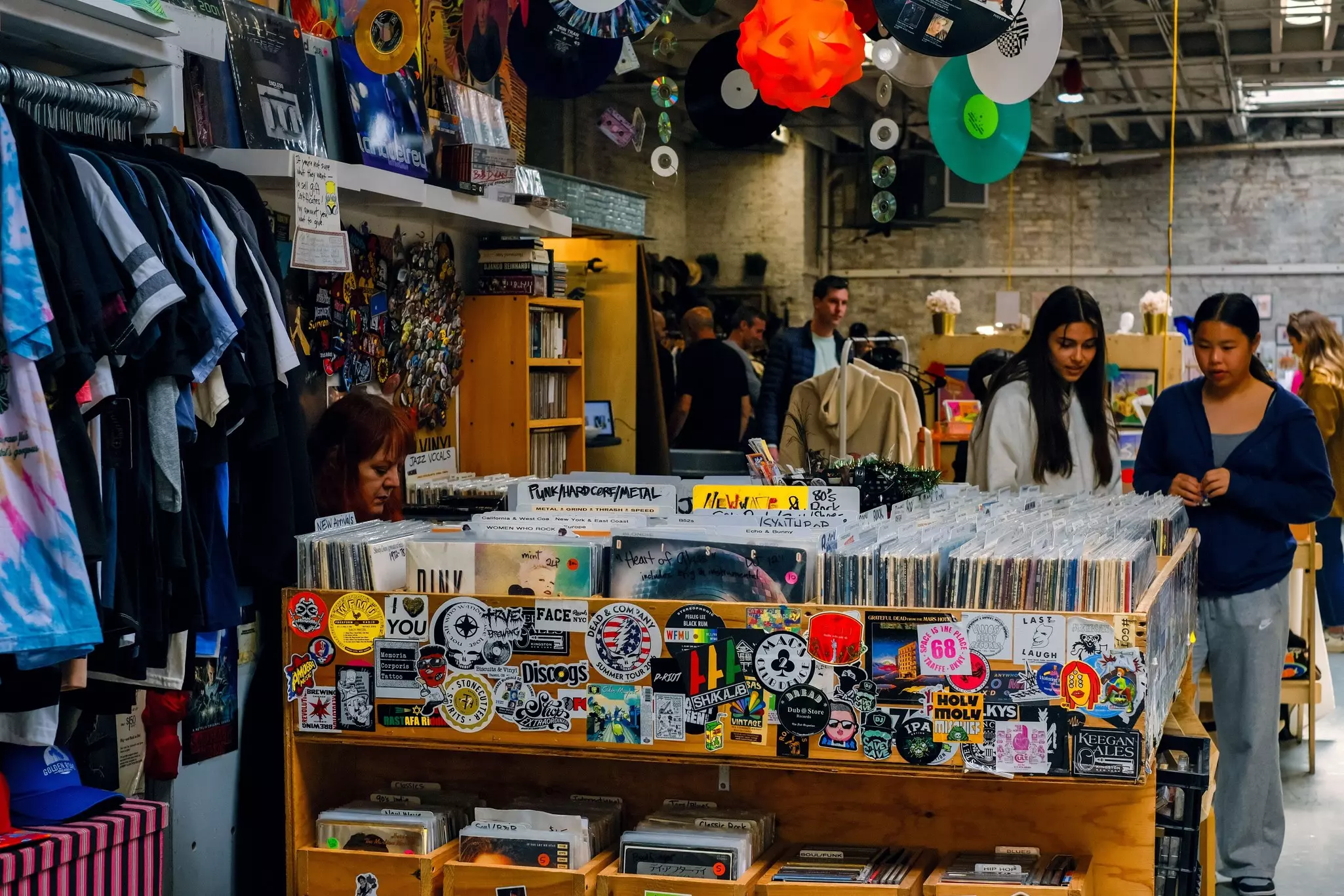 A view of people snapping a bargain flea market vintage second hand shop in Williamsburg