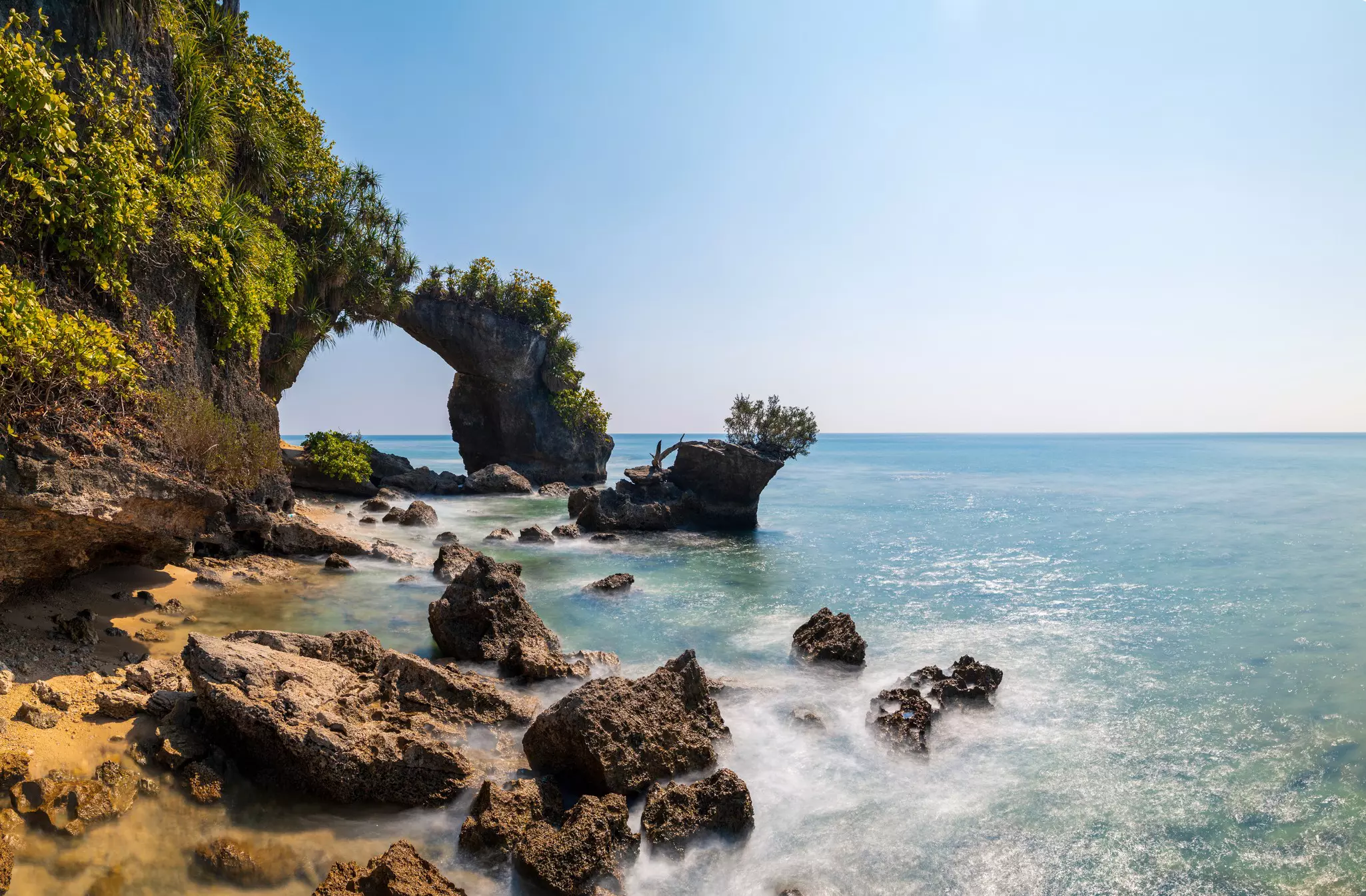 A natural rock arch on Lakshmanpur Beach 2 on Shaheed Dweep (Neil Island) in the Andaman Islands, India.