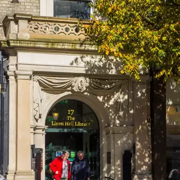 A couple of elderly gentlemen at the entrance of Belfast's Linen Hall Library in Donegall Square North Belfast. This famous library is a centre of cultural heritage in Northern Ireland.