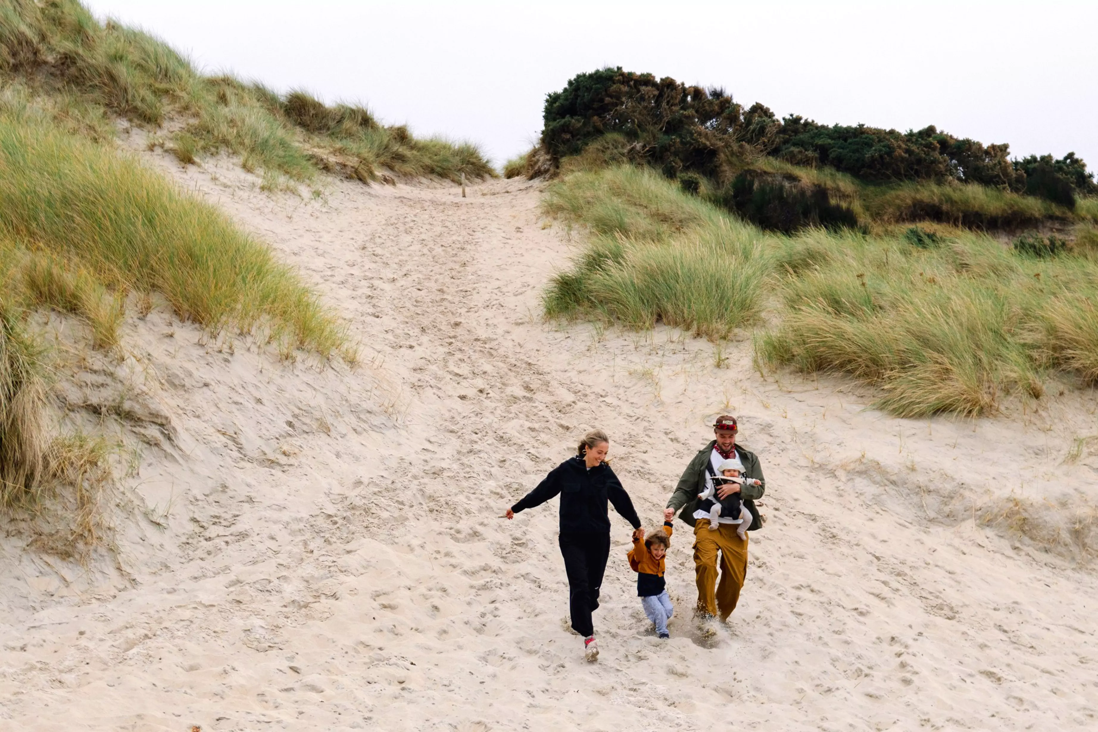The family enjoying the sand dunes at Sanna Bay on the Ardnamurchan peninsula.
